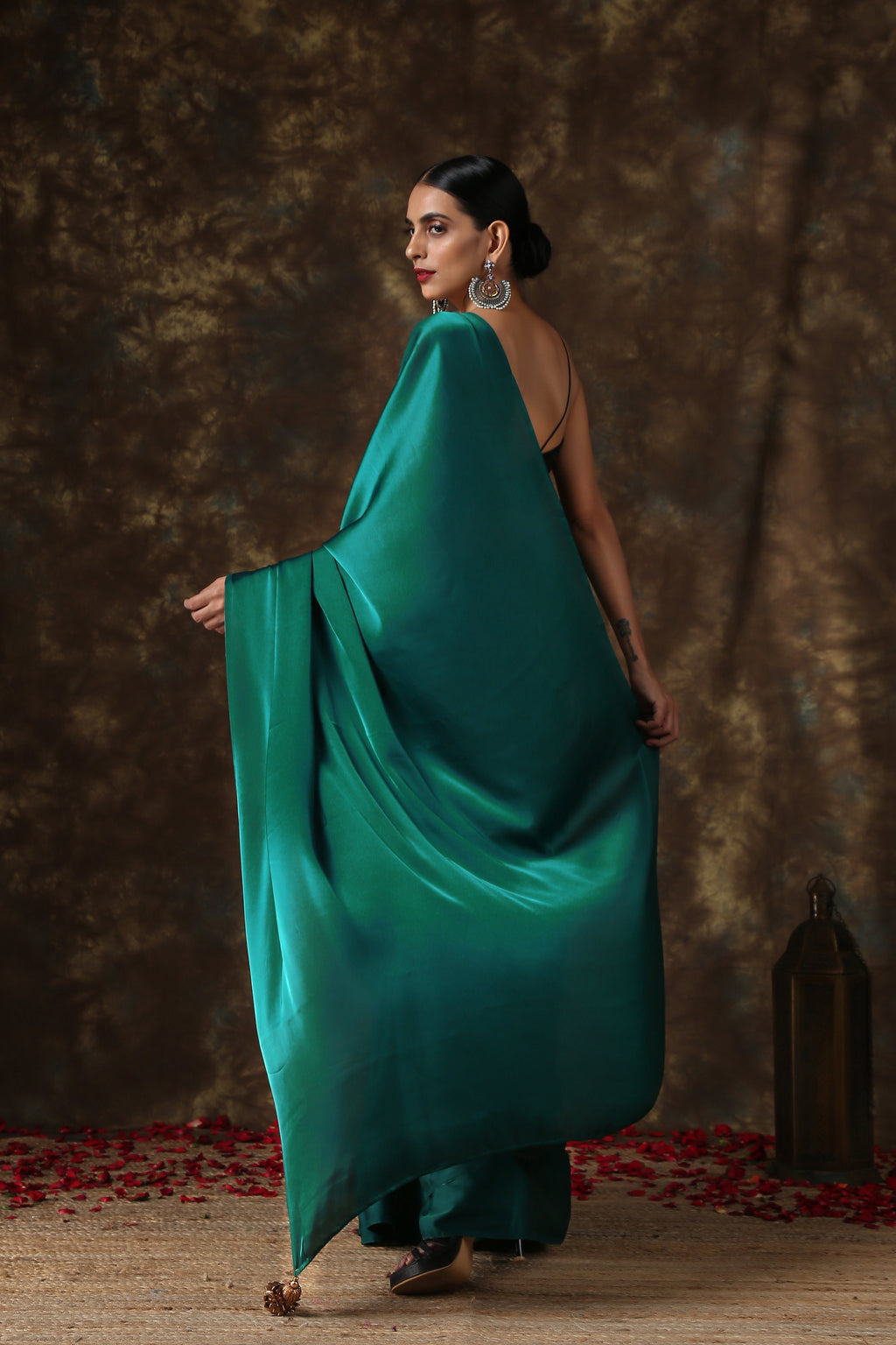 Rich Emerald Green Satin Saree with Bronze Pendants